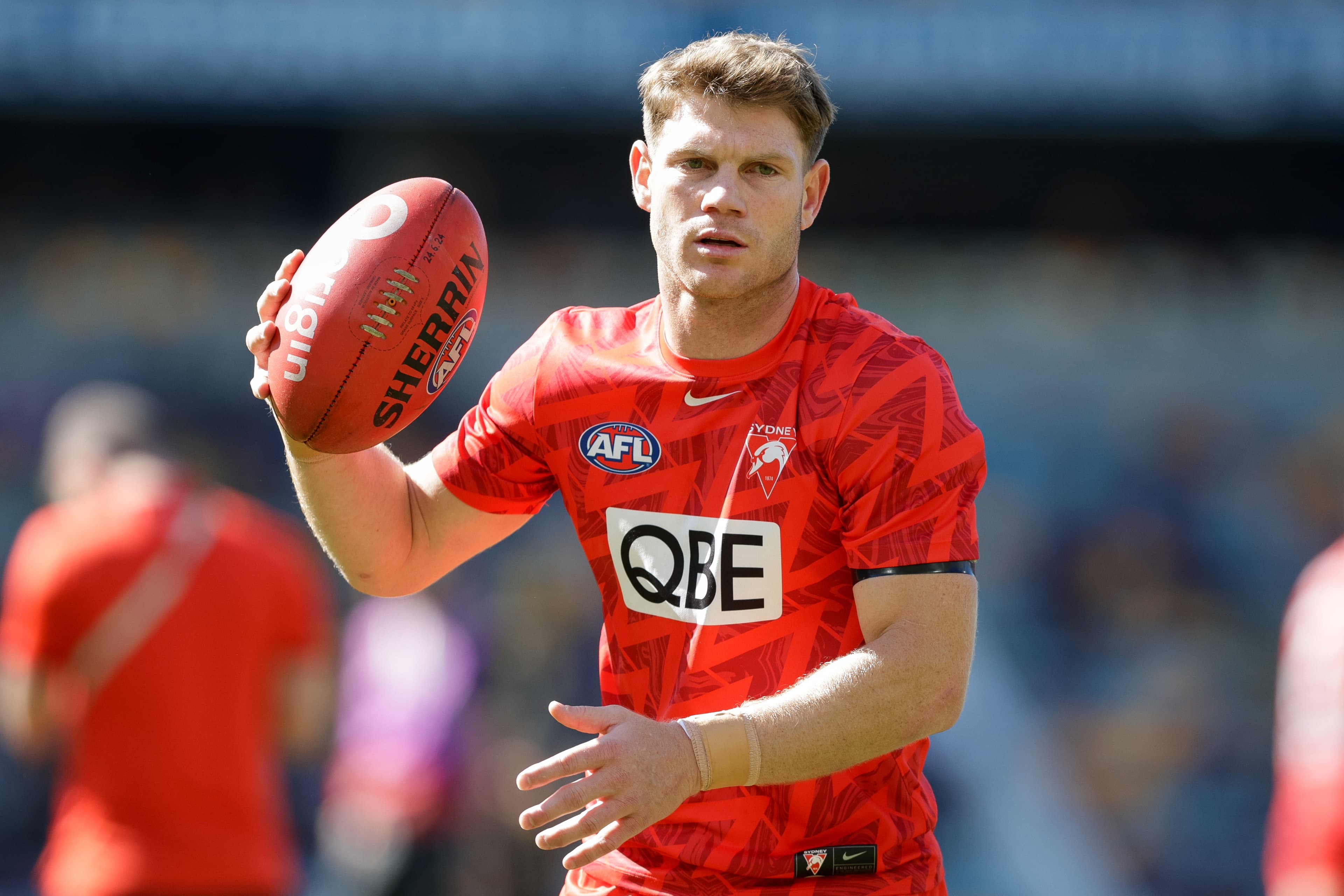 Swans midfielder knocked out in alleged assault in Sydney