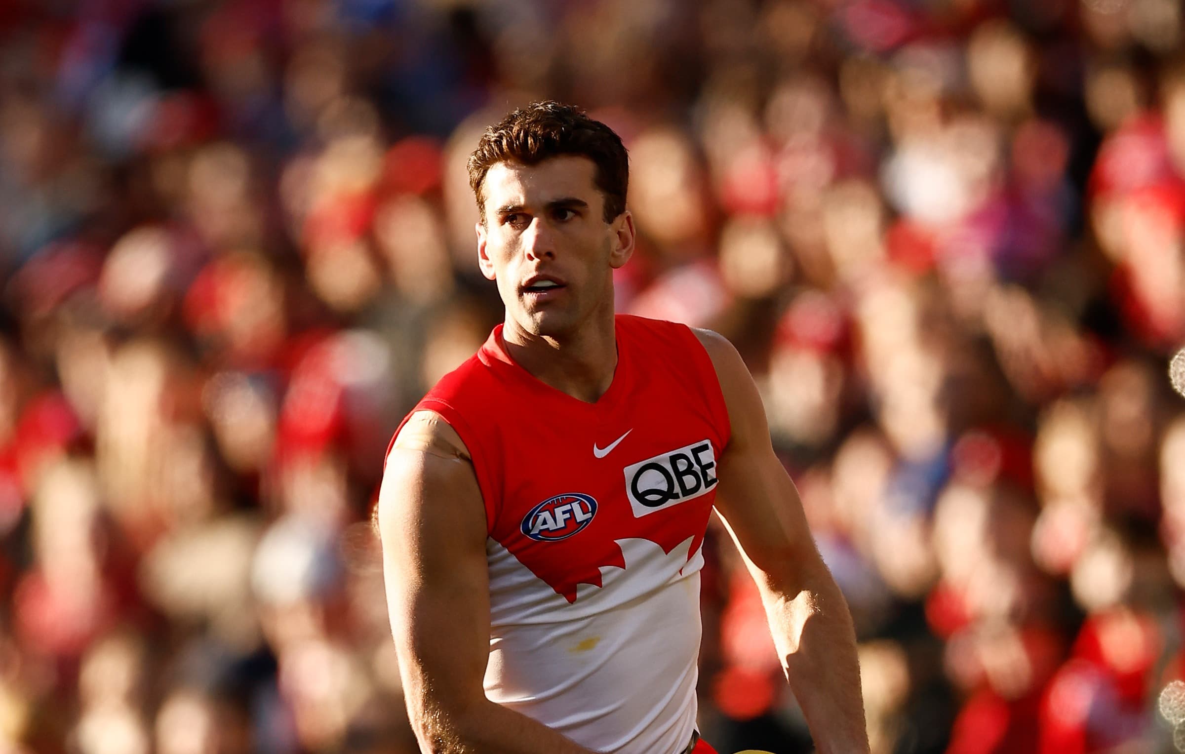 Versatile defender, father-son delisted as Swans cut four