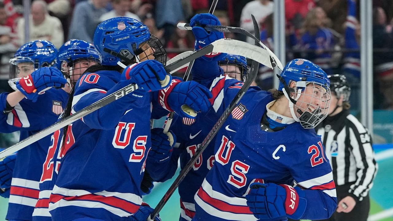 US claim dramatic overtime win to take ice hockey gold